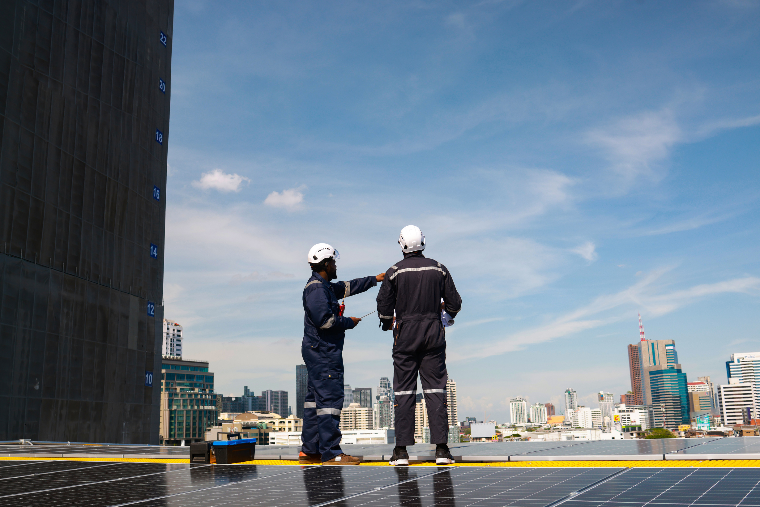 Solar engineer team discussing  Solar rooftop project for industrial . Green renewable energy